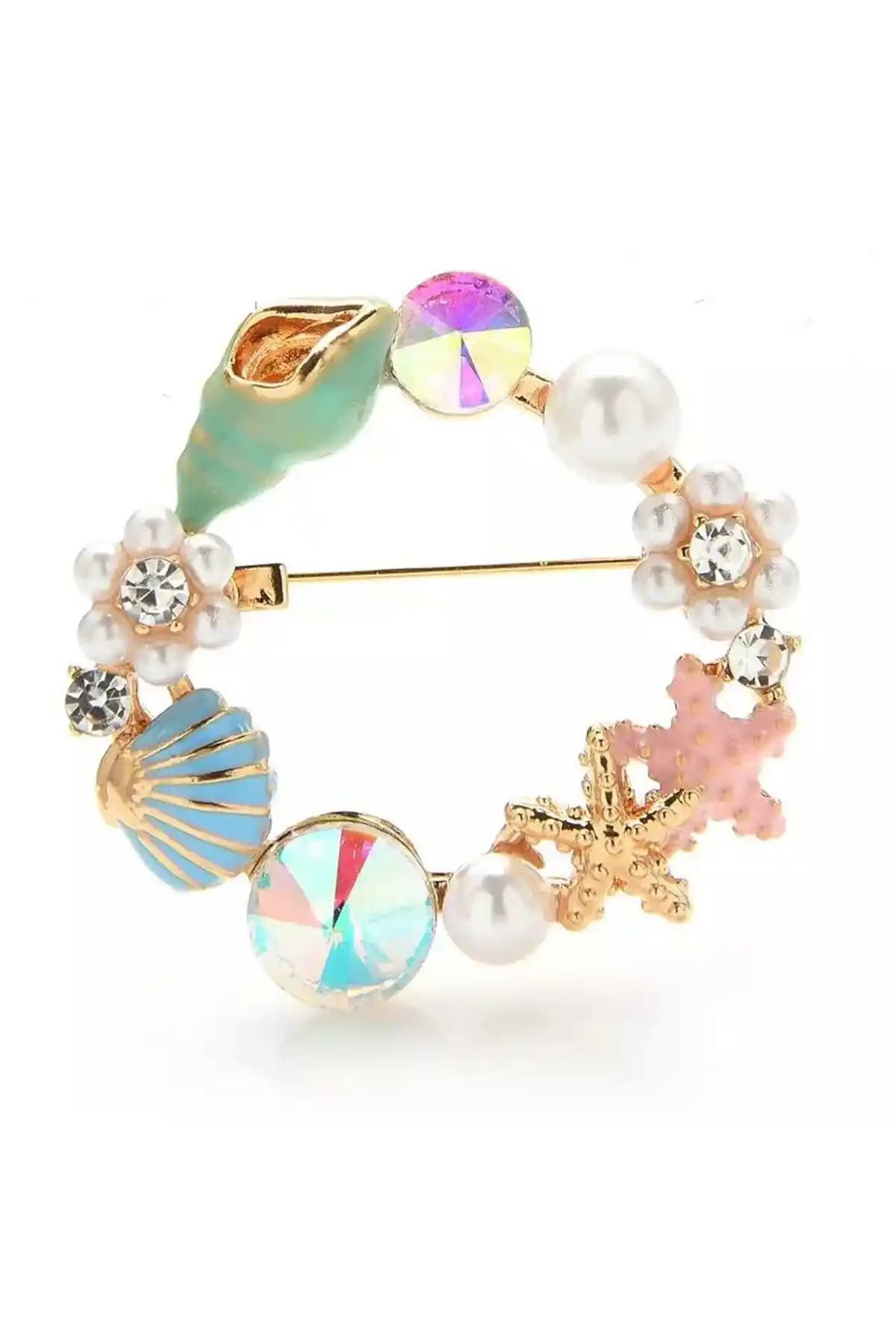 Pelin Aksesuar Mavi Deniz Kabuğu Broşu: Şıklık ve Zarafetin Modern Temsili